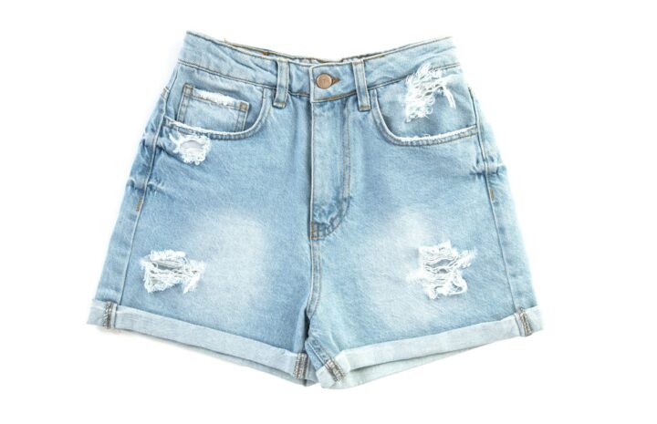 blue denim shorts on white surface