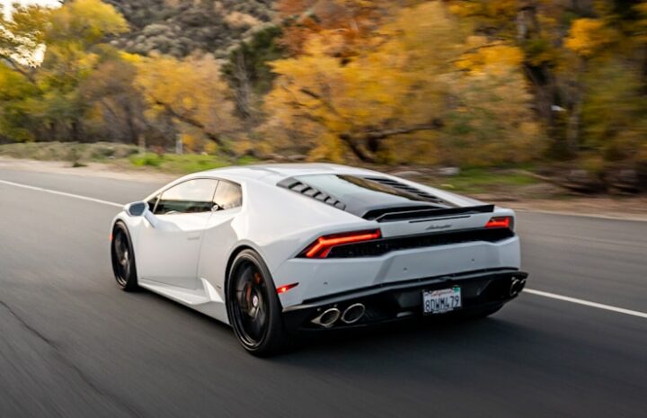 a white sports car on a road